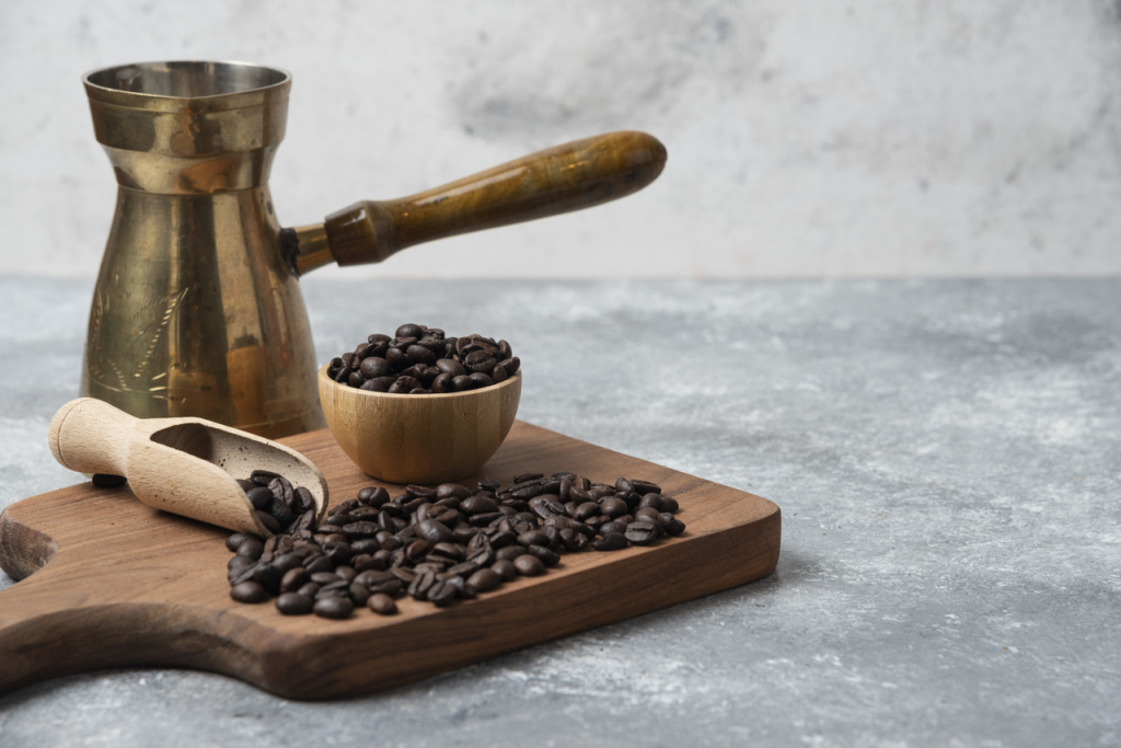 dark-roasted-coffee-beans-coffee-maker-wooden-cutting-board[1].jpg