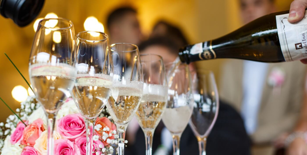 man-pours-champagne-glasses.jpg man-pours-champagne-glasses.jpg