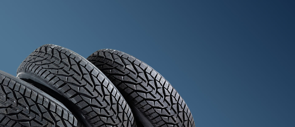 winter-car-tires-group-tires-winter-driving-blue-background